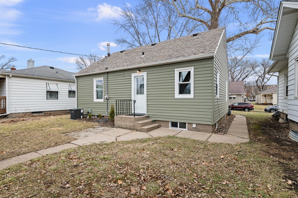 2036 46th Street Rock Island, IL 61201 - Photo 21 of 24 a view of a house with a yard and chair