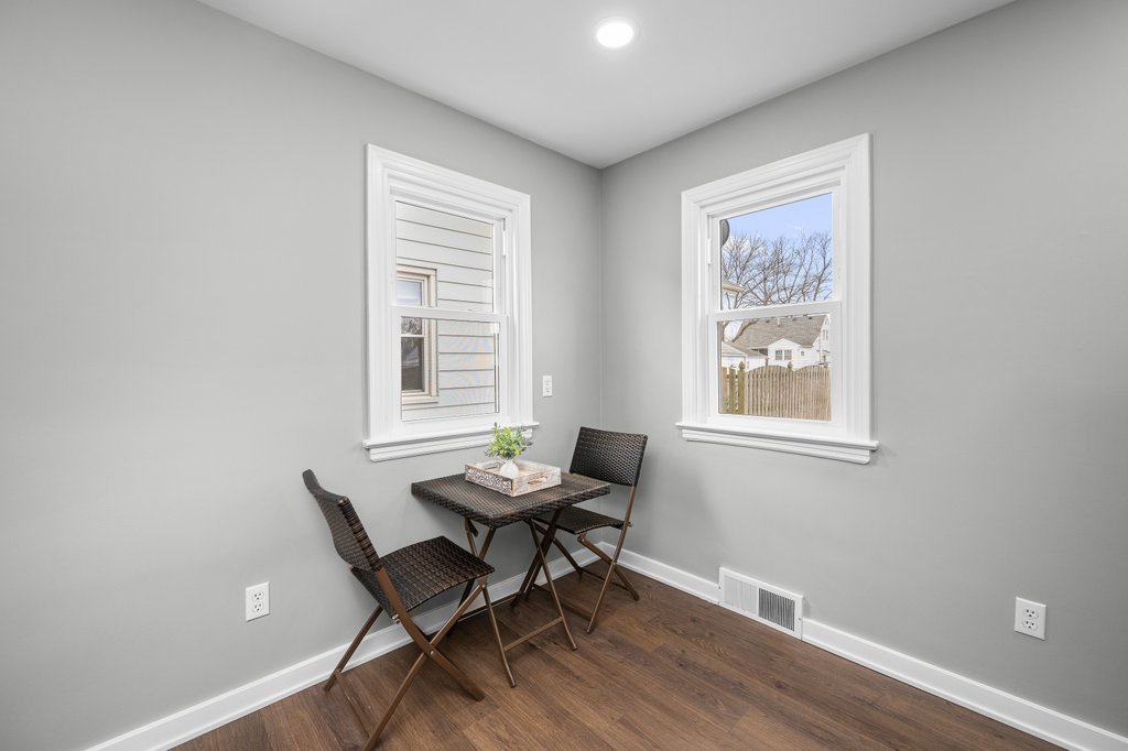 2036 46th Street Rock Island, IL 61201 - Photo 7 of 24 a workspace with wooden floor and a window
