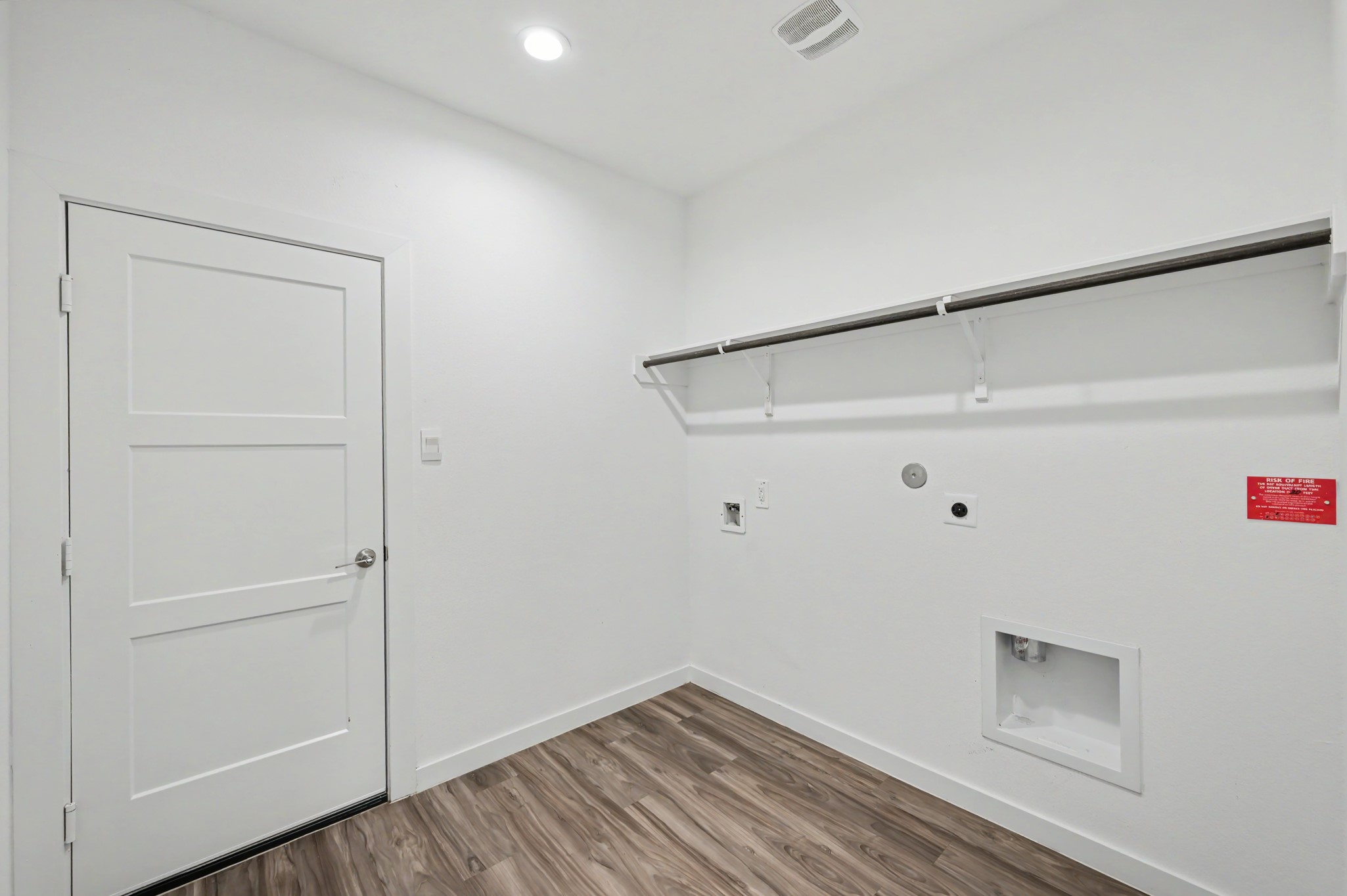 14162 Primrose Ridge Lane Conroe, TX 77384 - Photo 45 of 48 Discover a spacious laundry room with ample space for a fridge, combining functionality and convenience.