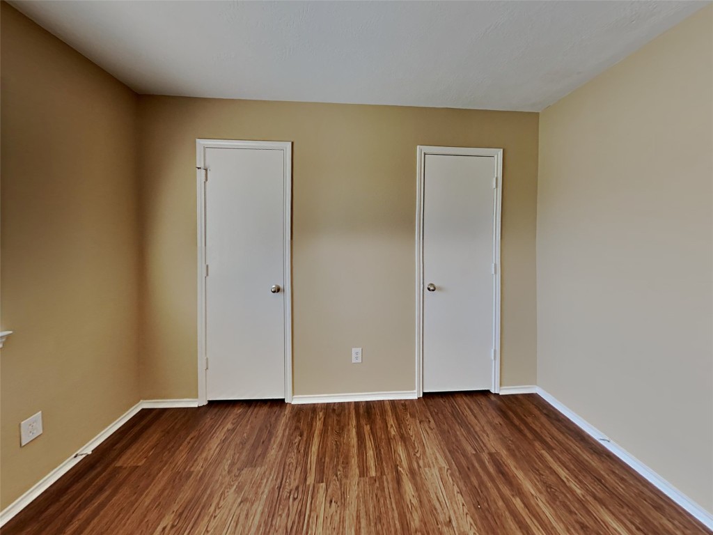 14427 Brunswick Point Lane Houston, TX 77047 - Photo 16 of 20 an empty room with wooden floor and closet