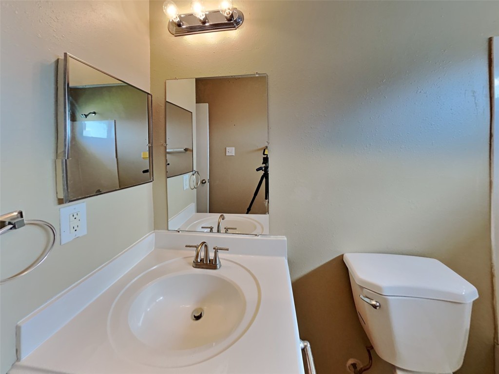 14427 Brunswick Point Lane Houston, TX 77047 - Photo 17 of 20 a bathroom with a sink mirror and toilet