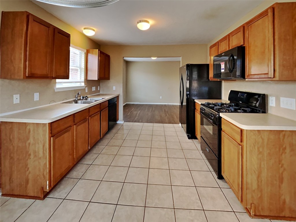 14427 Brunswick Point Lane Houston, TX 77047 - Photo 2 of 20 a large kitchen with stainless steel appliances granite countertop a stove a sink dishwasher and a refrigerator