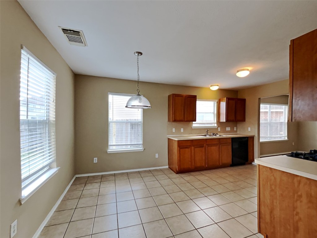 14427 Brunswick Point Lane Houston, TX 77047 - Photo 4 of 20 a large kitchen with a lot of counter space and a refrigerator