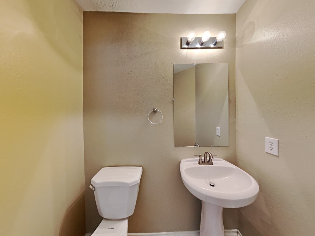 14427 Brunswick Point Lane Houston, TX 77047 - Photo 10 of 20 a bathroom with a sink and mirror