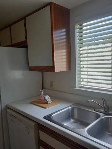 a kitchen with a sink and a window