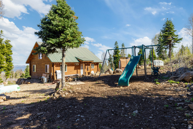 706 Tranquility Drive Springdale, UT 84767 - Photo 27 of 55 Backyard Play Area: Includes a children's playset tucked away in the trees.