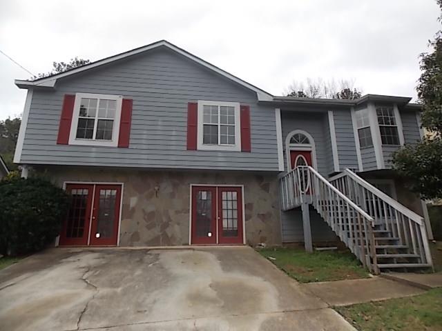 5075 Donnell Way Decatur, GA 30035 - Photo 1 of 1 a front view of a house with garage