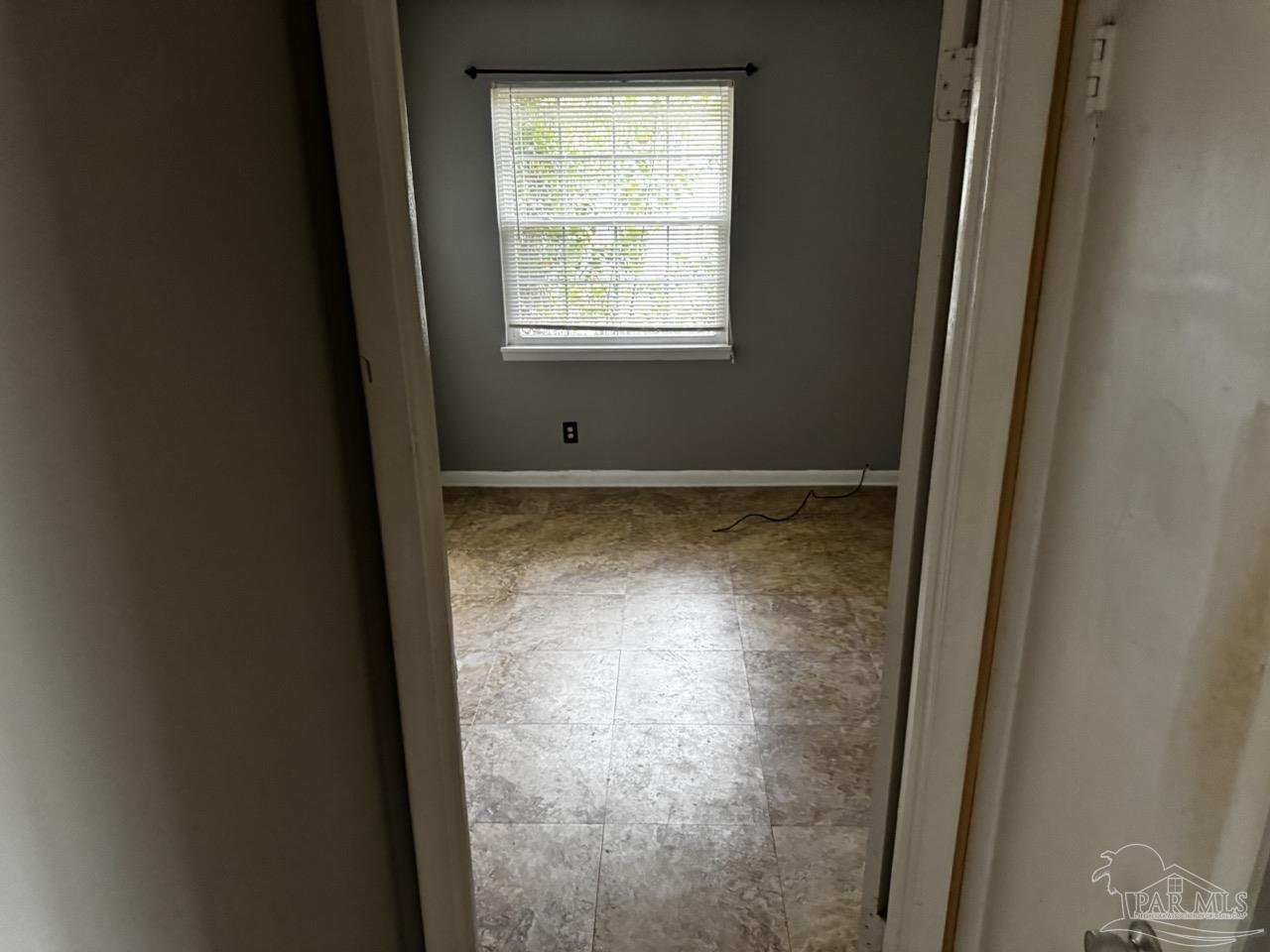 1460 Bakalane Court, Unit A Pensacola, FL 32504 - Photo 16 of 24 a view of empty room with window