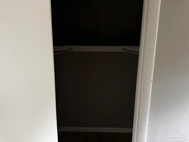 a view of a room with wooden walls