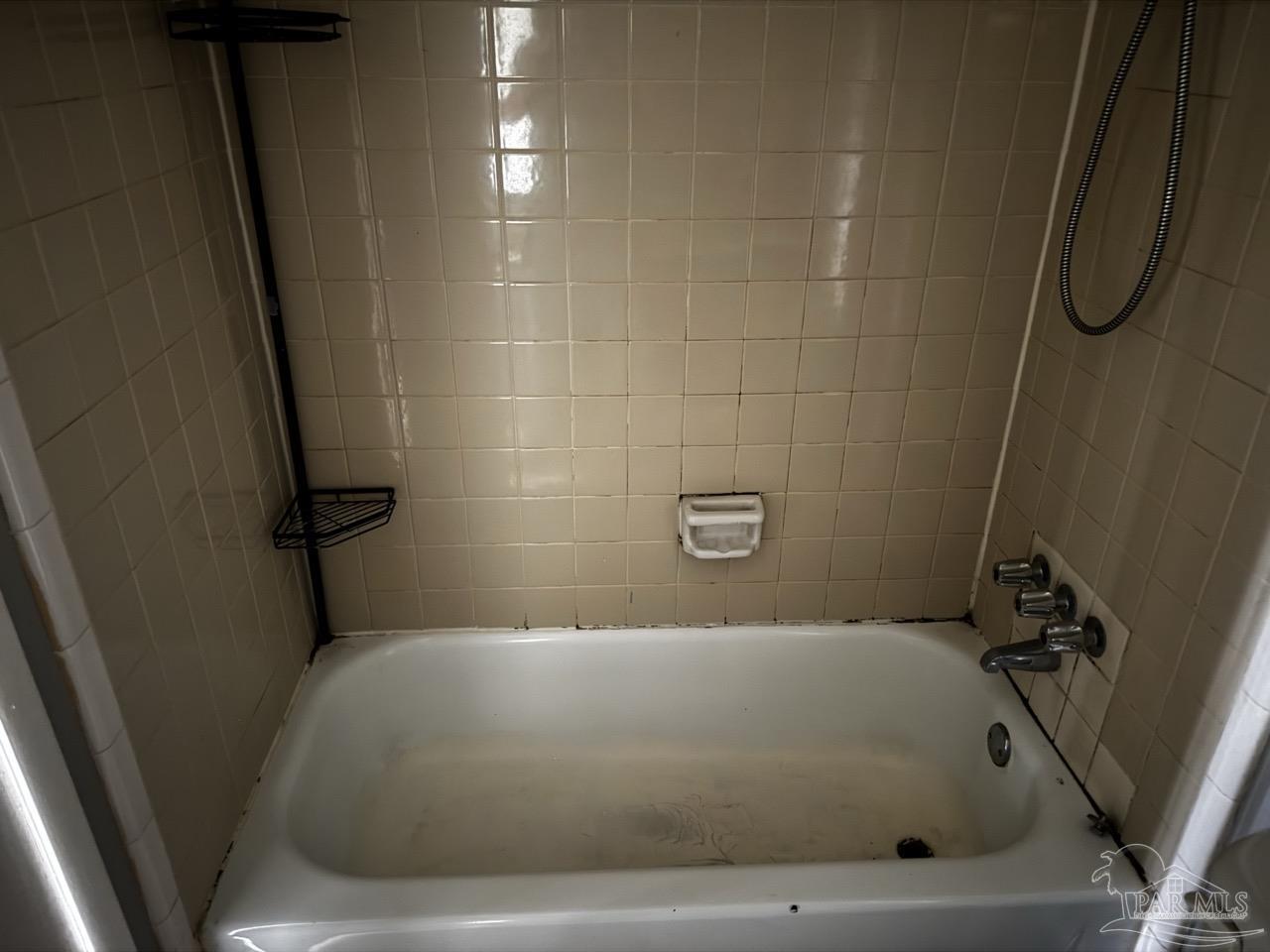 1460 Bakalane Court, Unit A Pensacola, FL 32504 - Photo 22 of 24 a bathroom with a bathtub