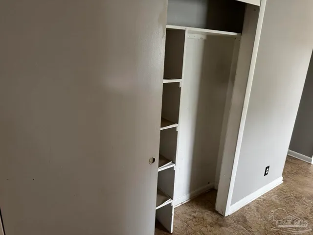 a view of walk in closet with window