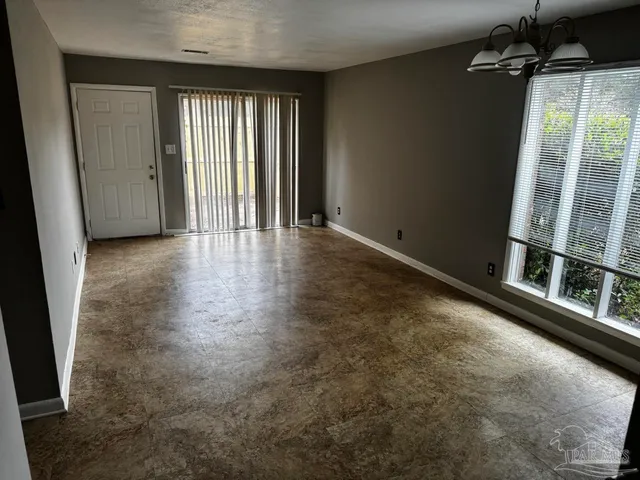 an empty room with windows