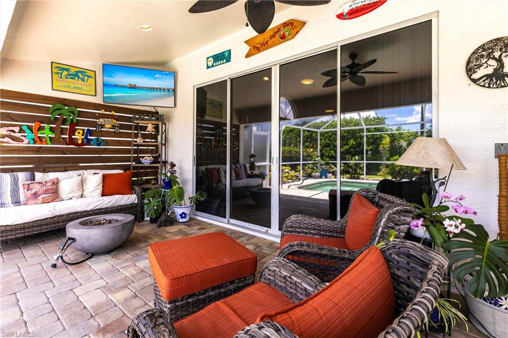 6769 Berwick Place Naples, FL 34104 - Photo 13 of 21 a outdoor living space with patio furniture and potted plants