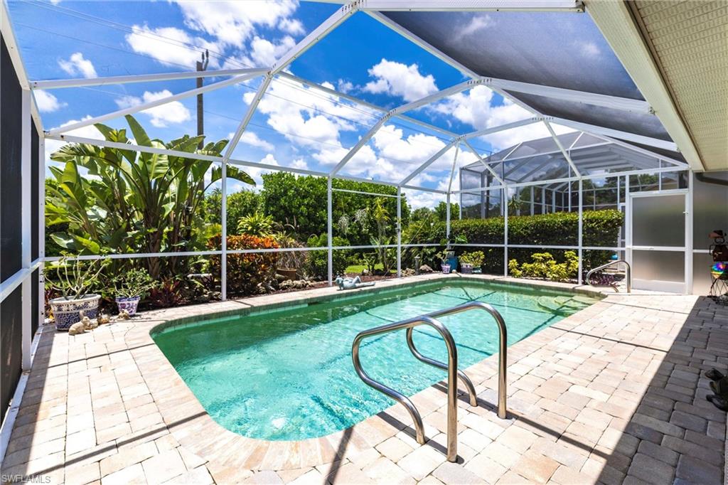 6769 Berwick Place Naples, FL 34104 - Photo 14 of 21 a view of a house with backyard and sitting area
