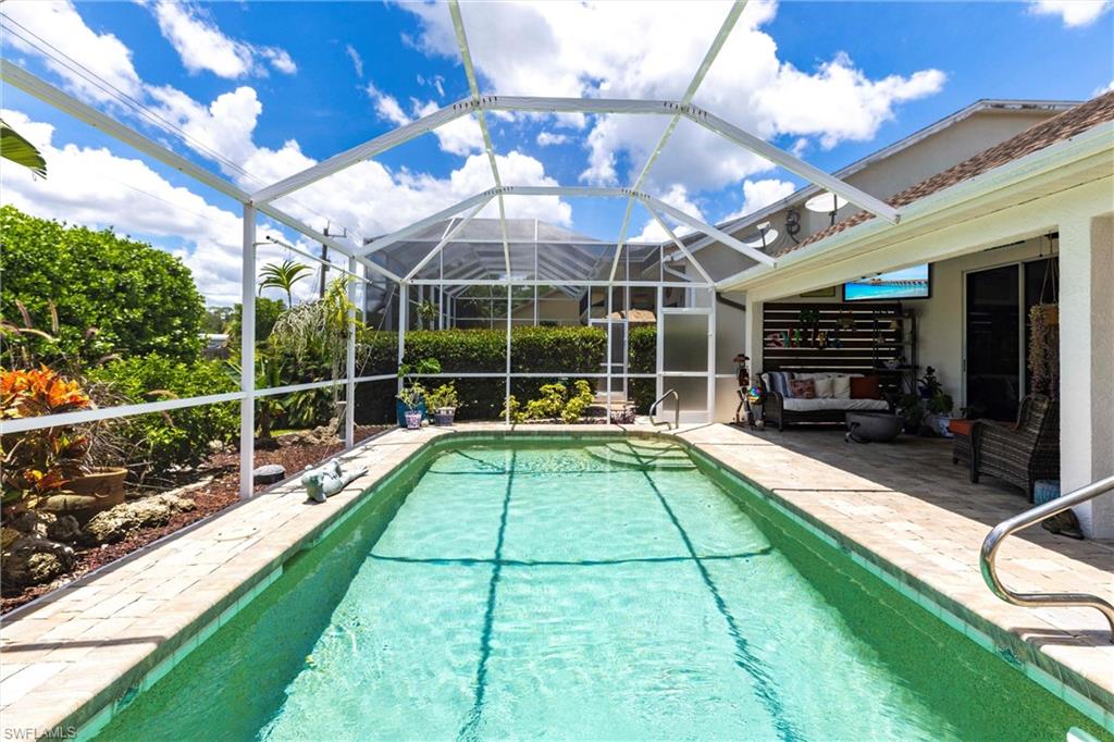 6769 Berwick Place Naples, FL 34104 - Photo 15 of 21 a view of a backyard with sitting area