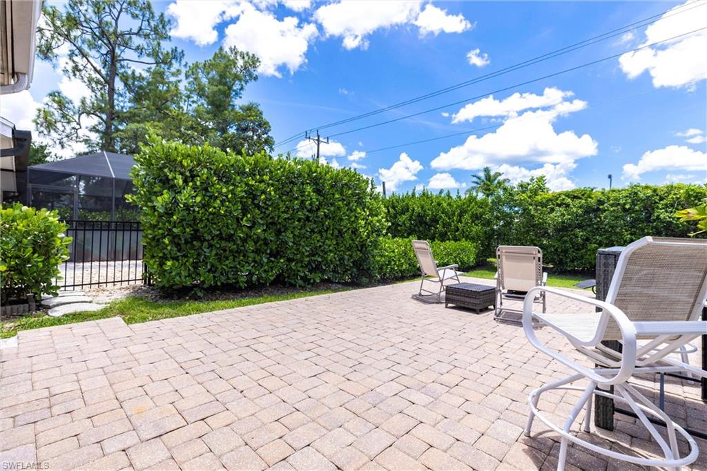 6769 Berwick Place Naples, FL 34104 - Photo 17 of 21 a view of a backyard with sitting area