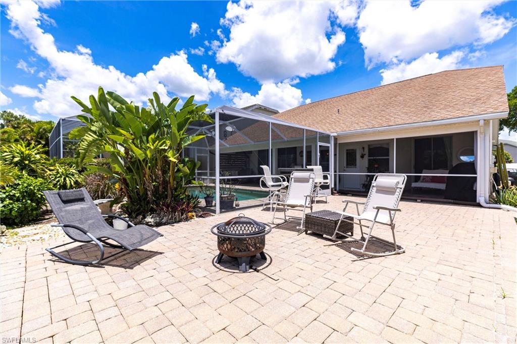 6769 Berwick Place Naples, FL 34104 - Photo 19 of 21 a building outdoor space with patio furniture and potted plants