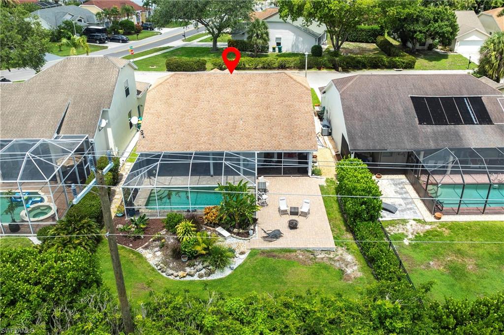 6769 Berwick Place Naples, FL 34104 - Photo 21 of 21 an aerial view of a house with swimming pool and garden