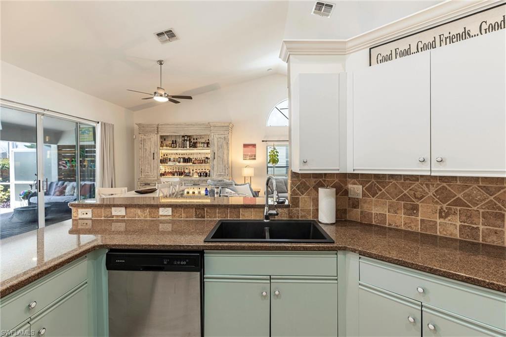 6769 Berwick Place Naples, FL 34104 - Photo 5 of 21 a kitchen with a sink and cabinets