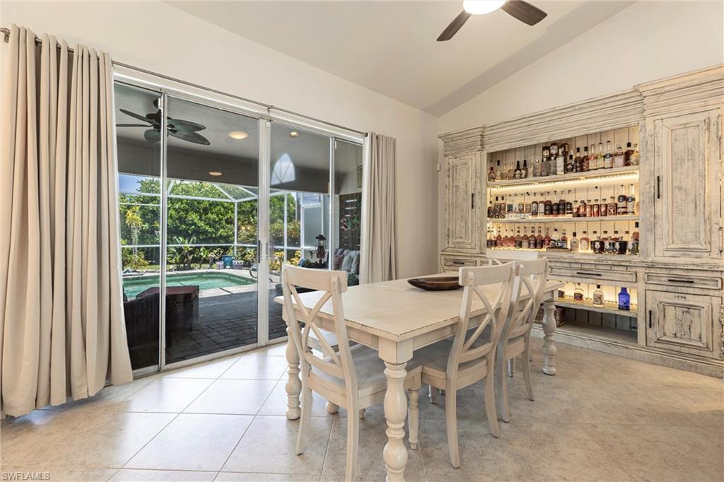 6769 Berwick Place Naples, FL 34104 - Photo 6 of 21 a view of a dining room with furniture window and outside view