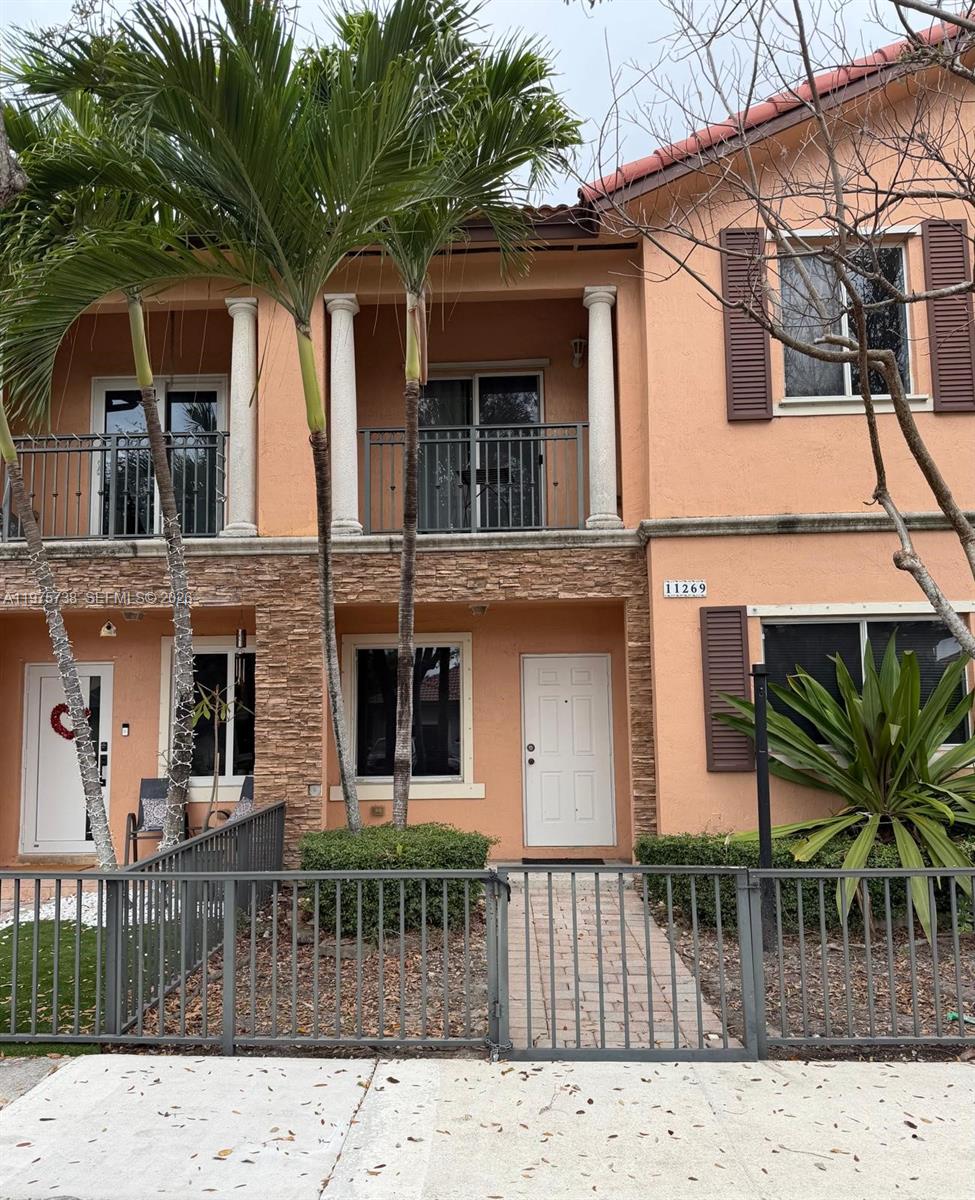 11269 Southwest 231st Lane Miami, FL 33170 - Photo 1 of 19 a front view of a house with a porch