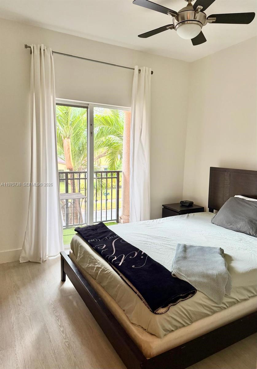 11269 Southwest 231st Lane Miami, FL 33170 - Photo 11 of 19 a bedroom with a bed and window