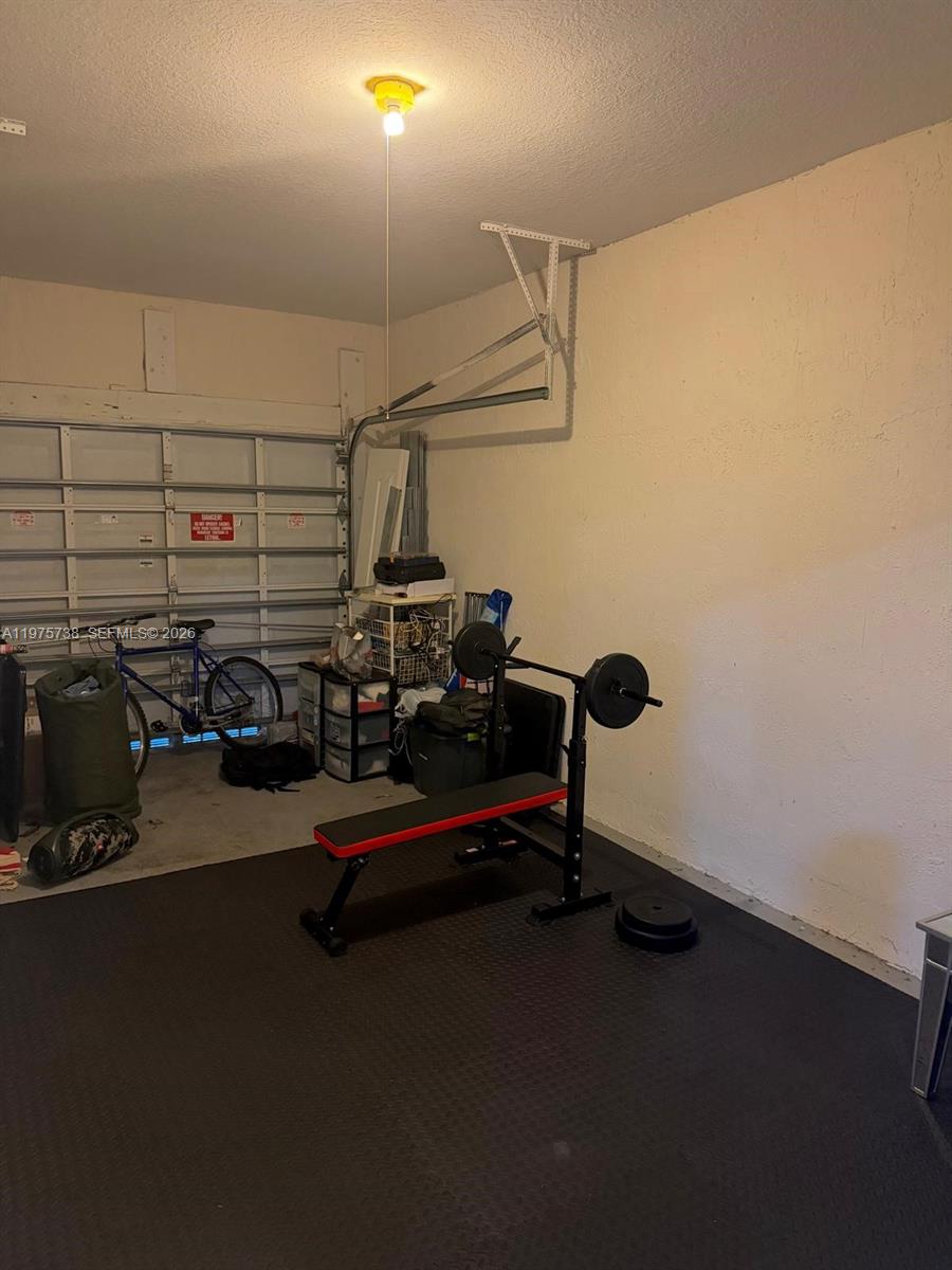 11269 Southwest 231st Lane Miami, FL 33170 - Photo 19 of 19 a view of a room with gym equipment