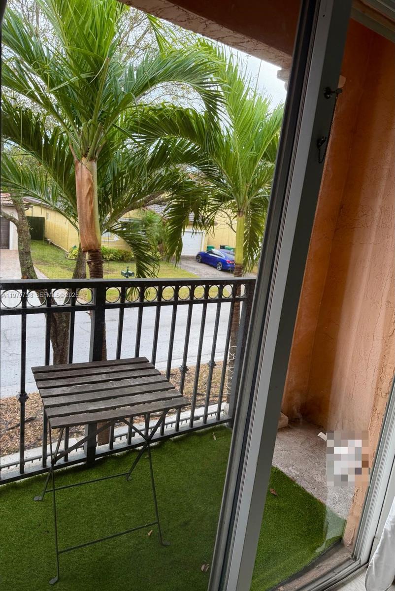 11269 Southwest 231st Lane Miami, FL 33170 - Photo 10 of 19 a view of a porch with a bench