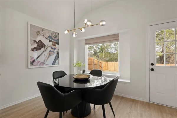 a dining room with furniture and window