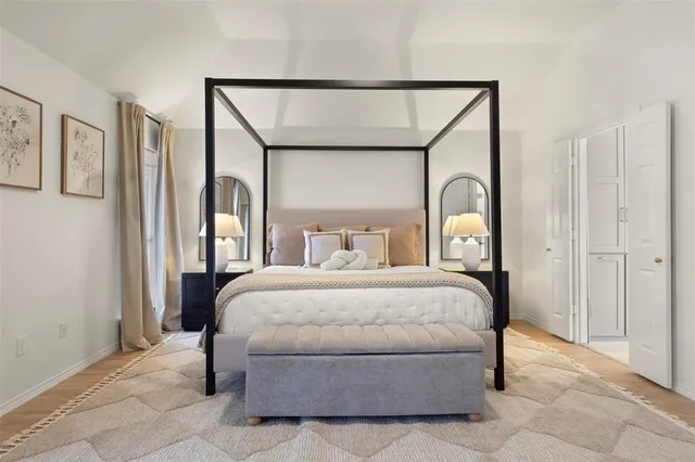 a bedroom with a bed and a night stand