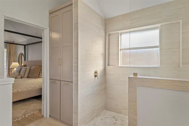 a en suite bathroom with a sink and a mirror