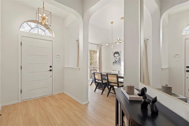 a view of a livingroom with furniture and lounge chair