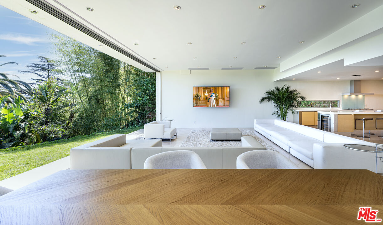 1466 Bel Air Road Los Angeles, CA 90077 - Photo 15 of 35 a living room with furniture and a large window