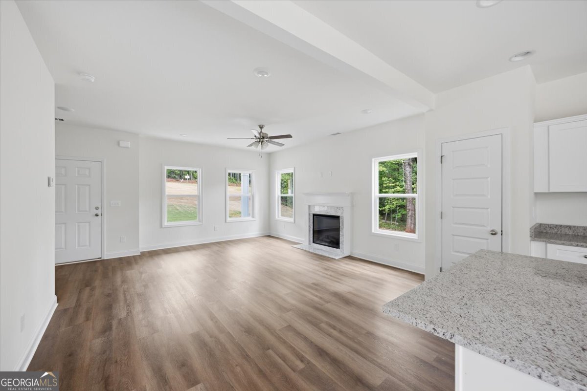 2778 Boxankle Road Forsyth, GA 31029 - Photo 10 of 21 an empty room with windows and fireplace