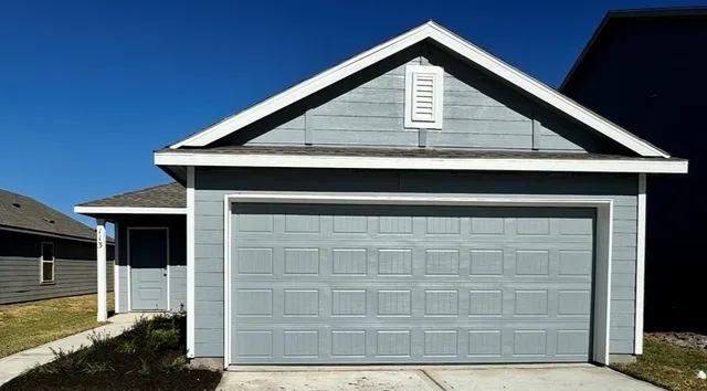 a kitchen with stainless steel appliances a sink cabinets and a window