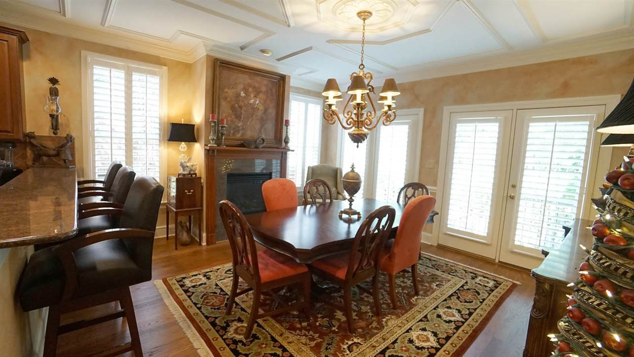1900 Torrington Street Raleigh, NC 27615 - Photo 18 of 30 Oversized, with french door access to one of the 2 private patios. Gas fireplace and intricate trim work on the ceiling Breakfast-Dining Area