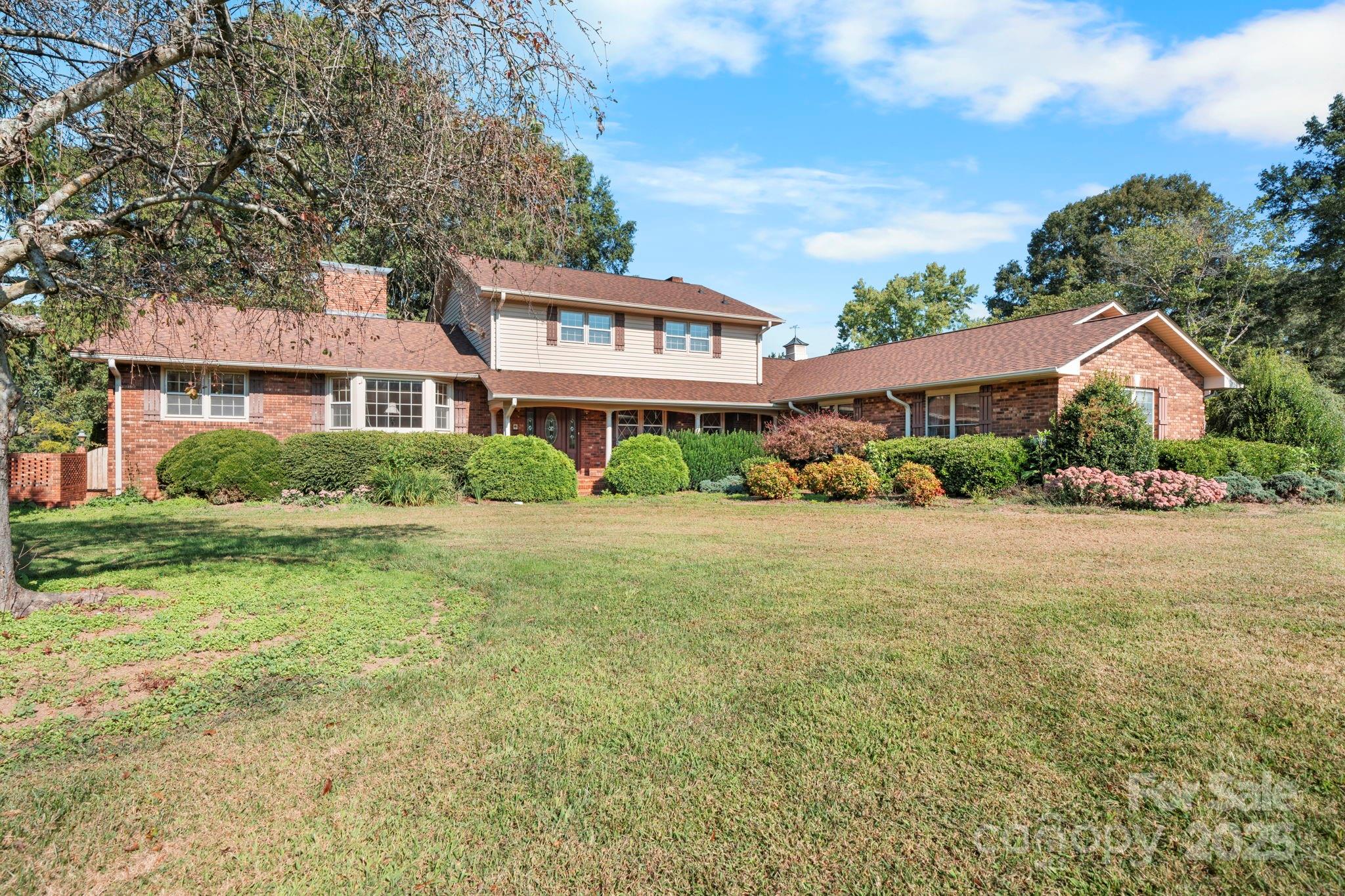 2551 Buffalo Shoals Road Newton, NC 28658 - Photo 1 of 47 a front view of a house with garden