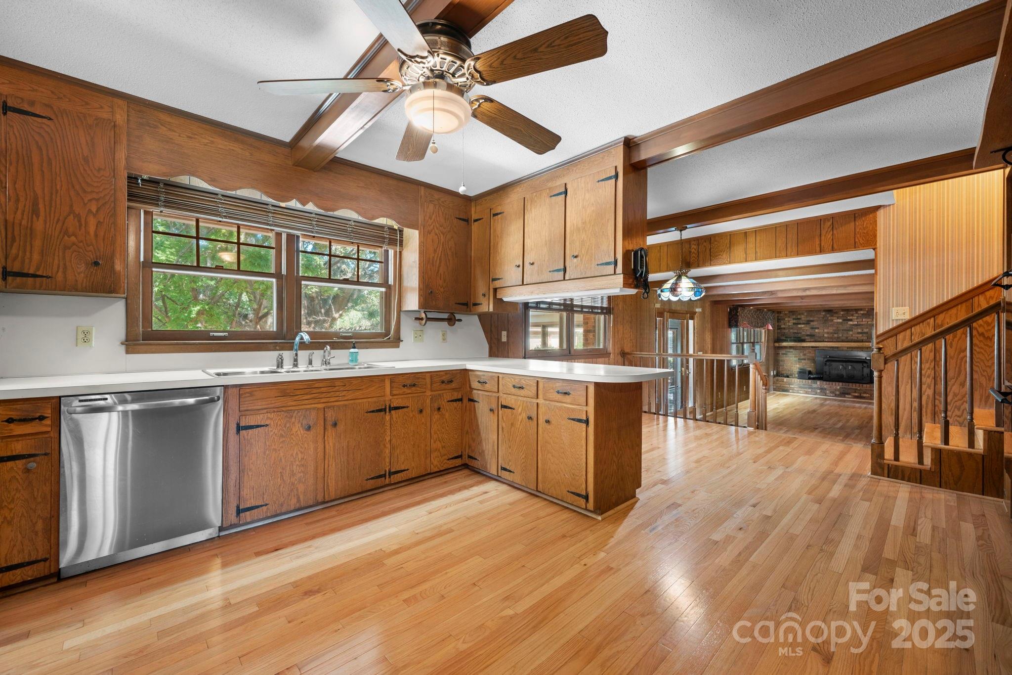 2551 Buffalo Shoals Road Newton, NC 28658 - Photo 11 of 47 a kitchen with stainless steel appliances granite countertop a sink cabinets and wooden floor
