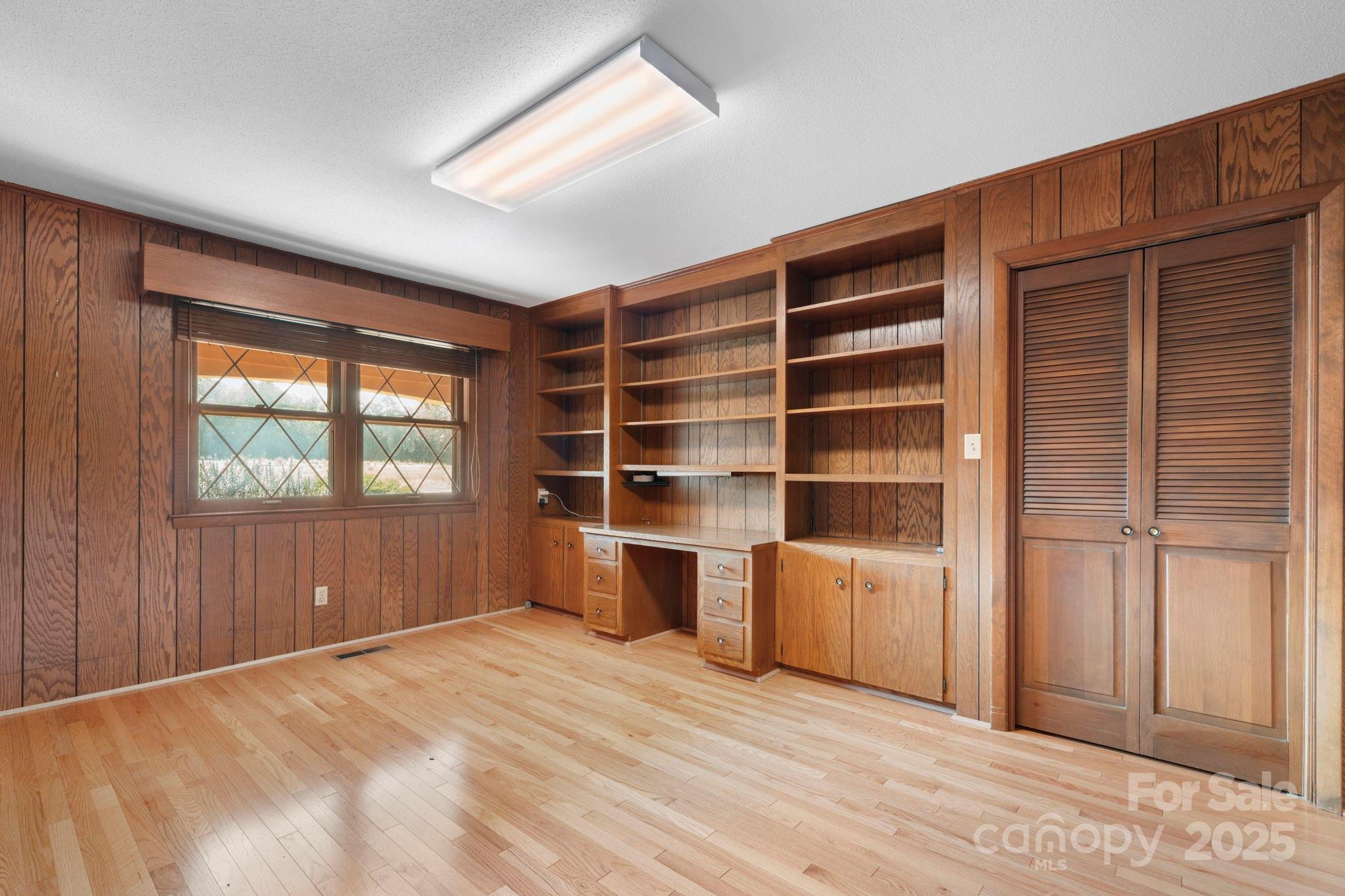 2551 Buffalo Shoals Road Newton, NC 28658 - Photo 16 of 47 a view of an empty room with a window and wooden floor