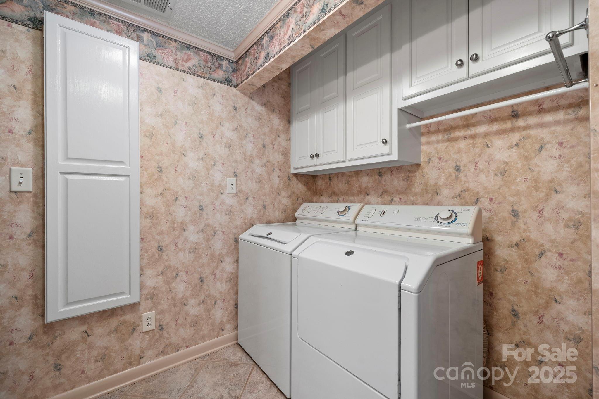 2551 Buffalo Shoals Road Newton, NC 28658 - Photo 18 of 47 a utility room with dryer and washer