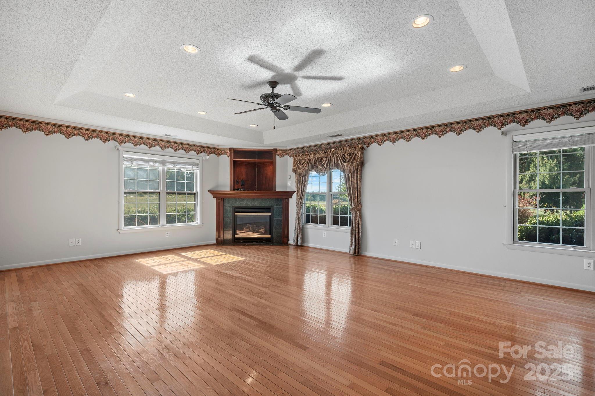2551 Buffalo Shoals Road Newton, NC 28658 - Photo 20 of 47 a view of an empty room with wooden floor fireplace and a window