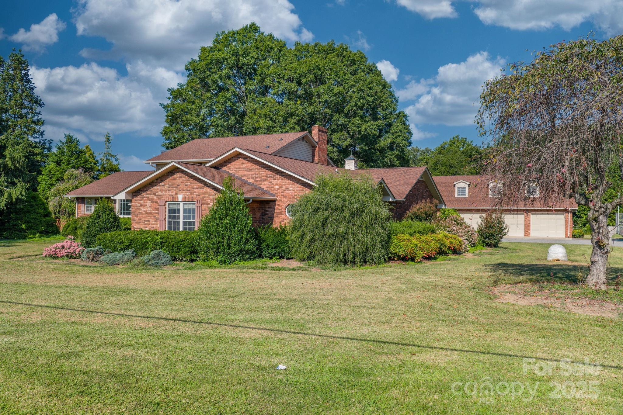 2551 Buffalo Shoals Road Newton, NC 28658 - Photo 2 of 47 a front view of house with yard and green space