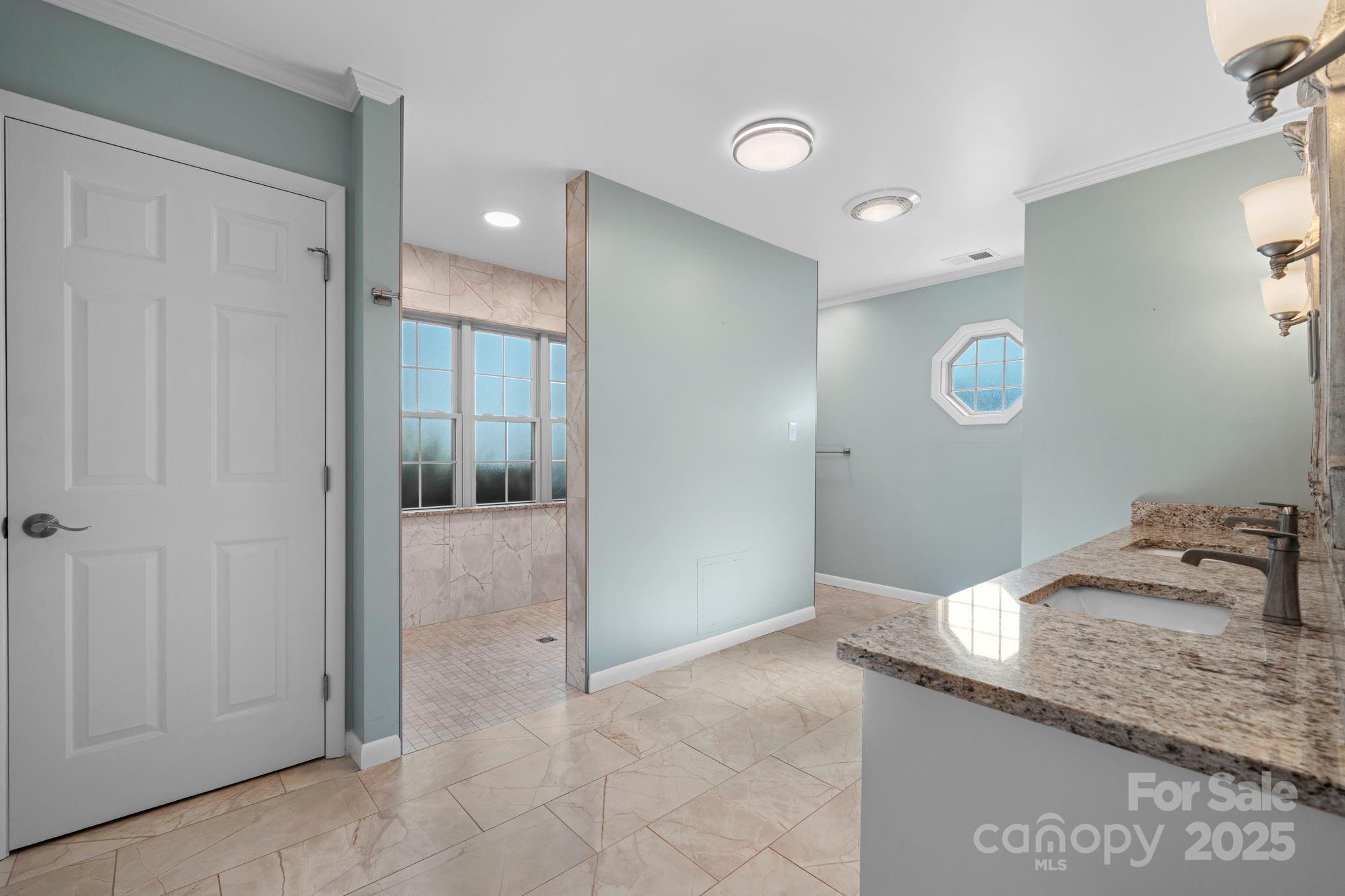 2551 Buffalo Shoals Road Newton, NC 28658 - Photo 21 of 47 a bathroom with a granite countertop sink and a mirror