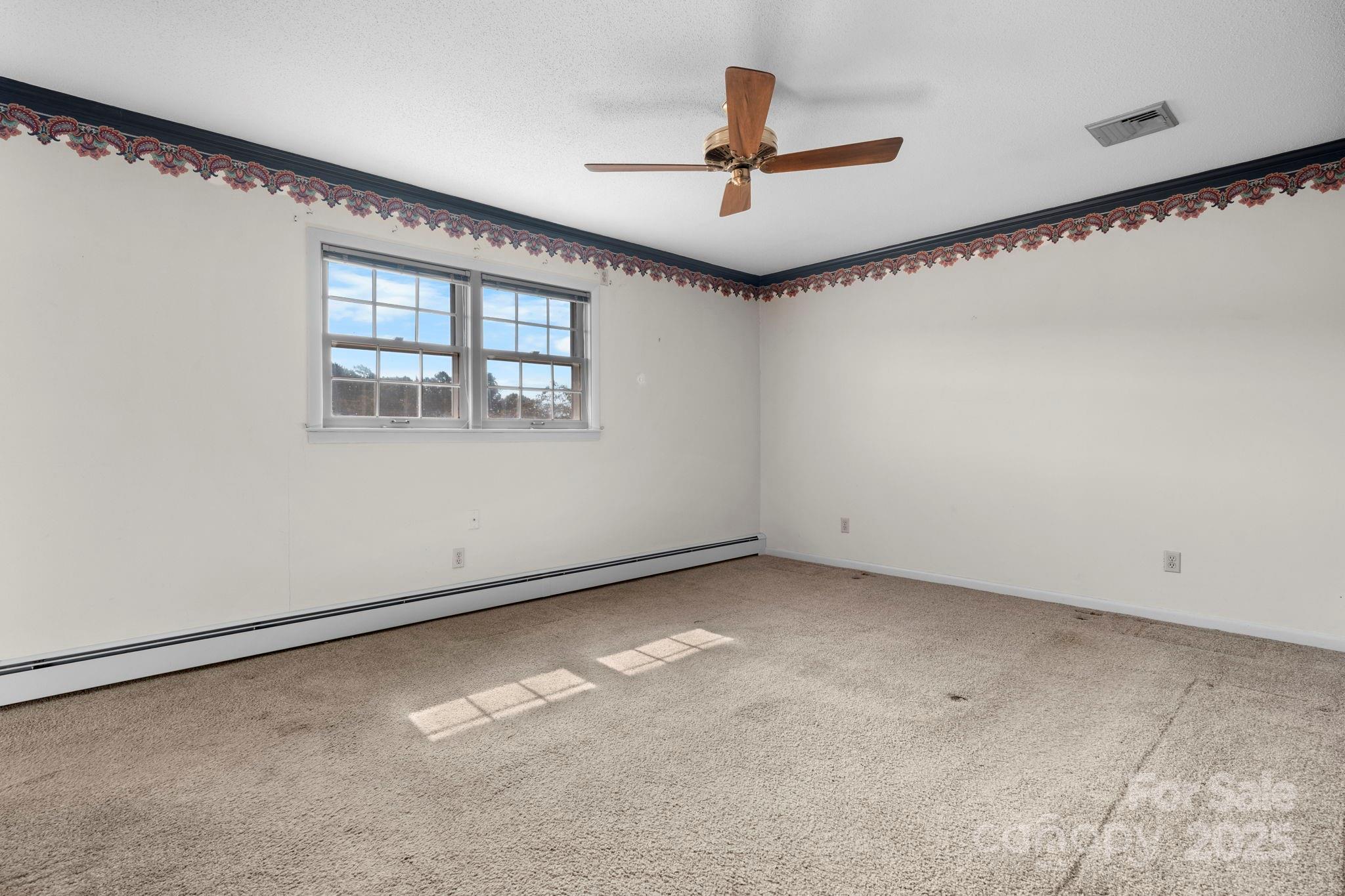 2551 Buffalo Shoals Road Newton, NC 28658 - Photo 28 of 47 a view of an empty room with a window
