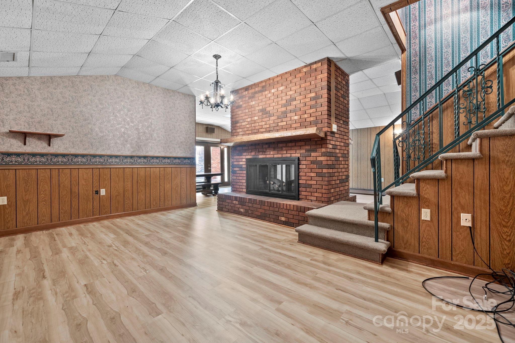2551 Buffalo Shoals Road Newton, NC 28658 - Photo 32 of 47 a view of a livingroom with wooden floor and a fireplace