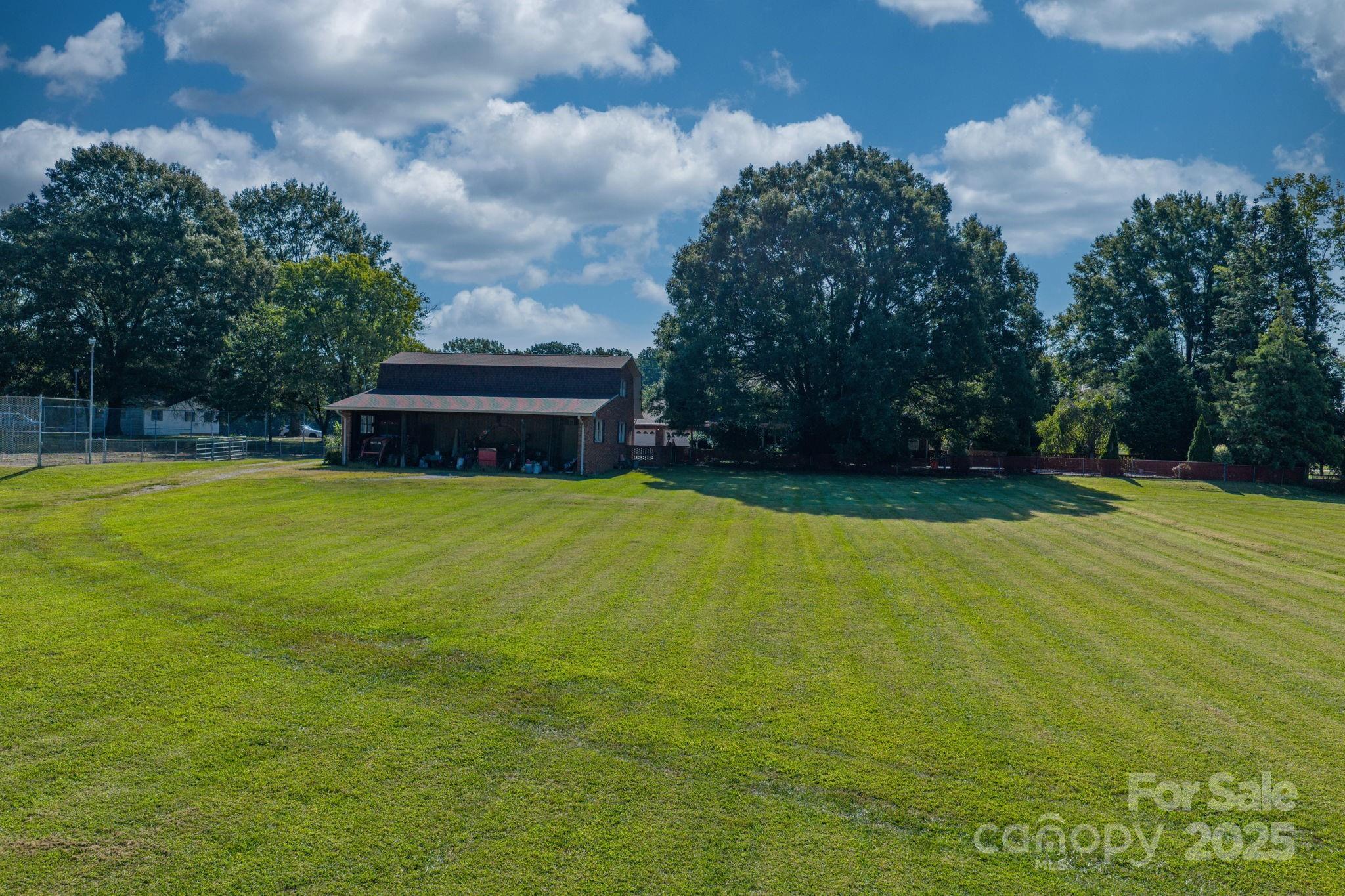2551 Buffalo Shoals Road Newton, NC 28658 - Photo 45 of 47 a view of a swimming pool with an outdoor space and seating area