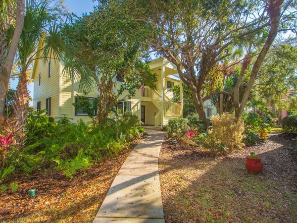 a view of a pathway with a yard
