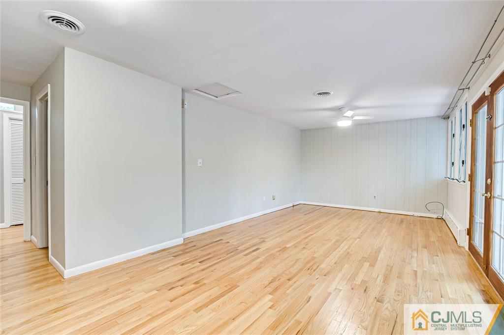 33 Davidson's Mill Road North Brunswick, NJ 08902 - Photo 43 of 58 a view of an empty room with wooden floor