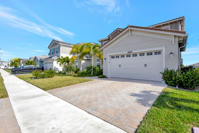 $699,000 | 4620 Ambersweet Way, The Acreage, FL 33470