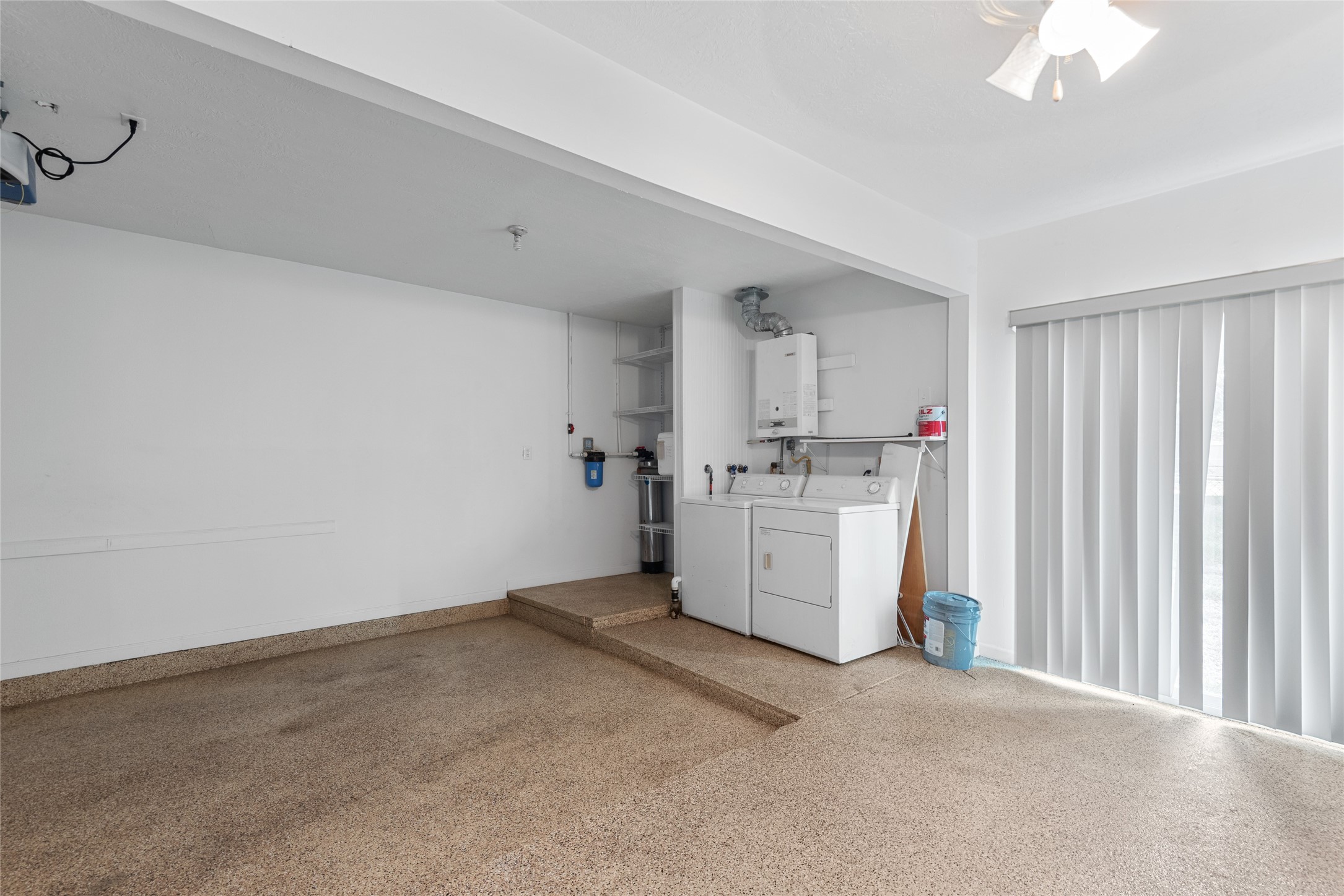 3734 Daphne Street Houston, TX 77021 - Photo 15 of 17 a utility room with cabinets washer and dryer